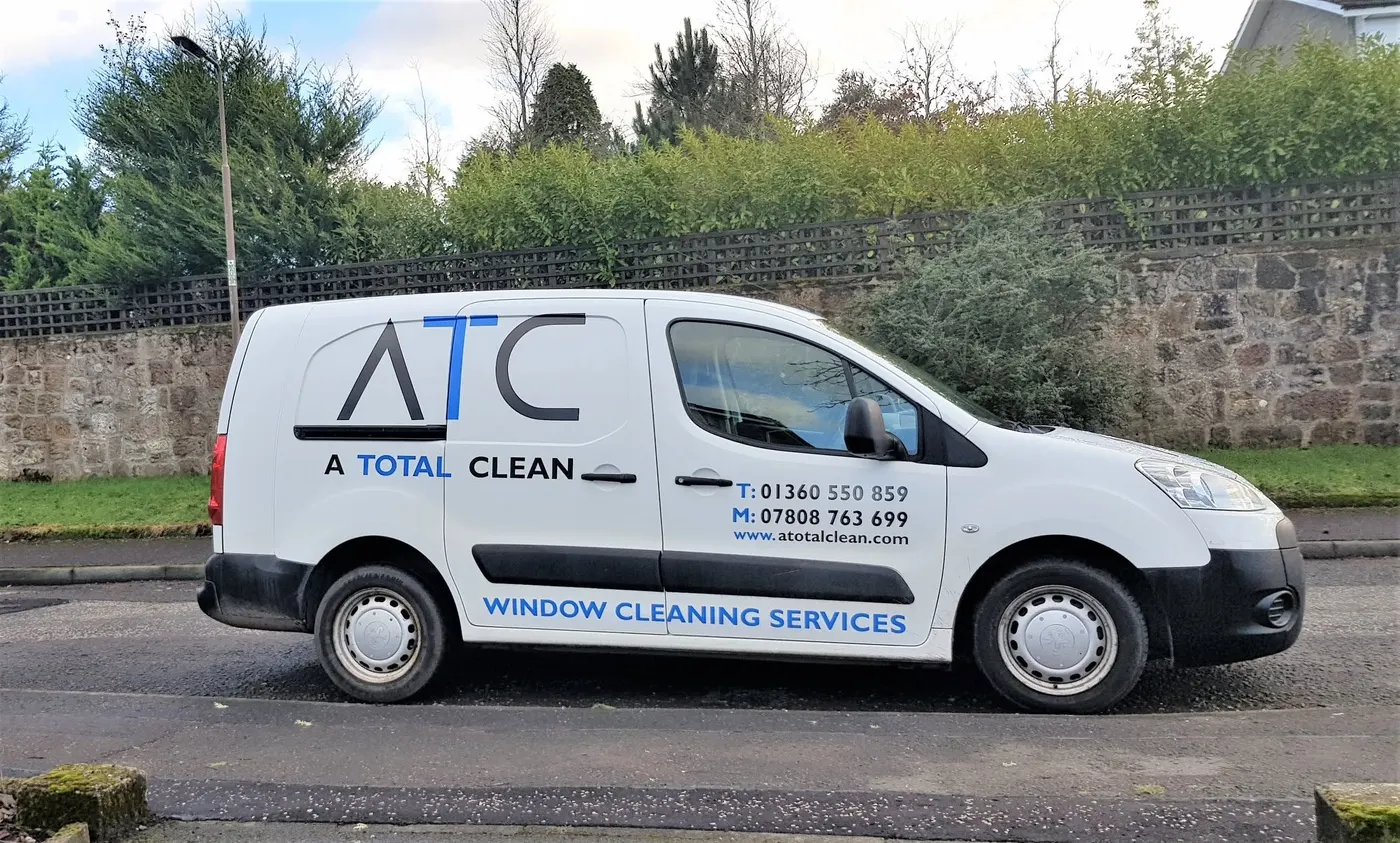 White A Total Clean van with the ATC logo parked on a village street